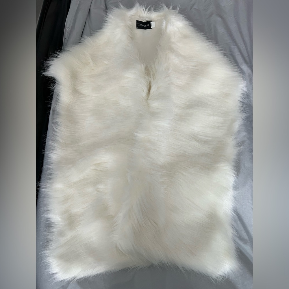 An elegant fur shrug/stole to wear with your gowns or cocktail dresses.